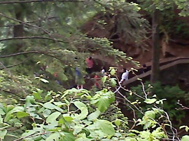 Looking down on the flip floppers that are at the upper viewing platform falls overlook