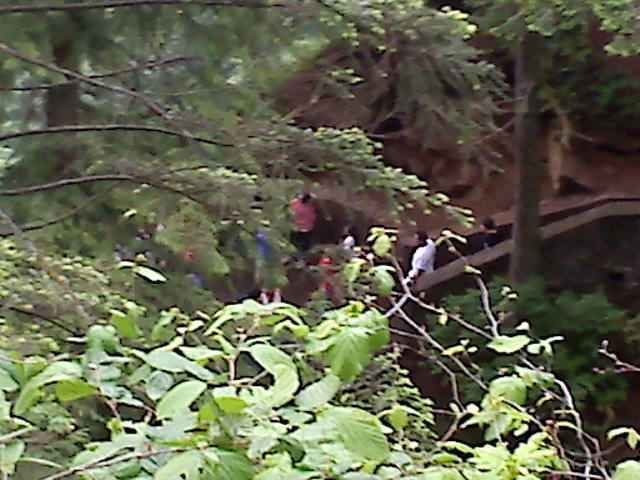 Looking down on the flip floppers that are at the upper viewing platform falls overlook