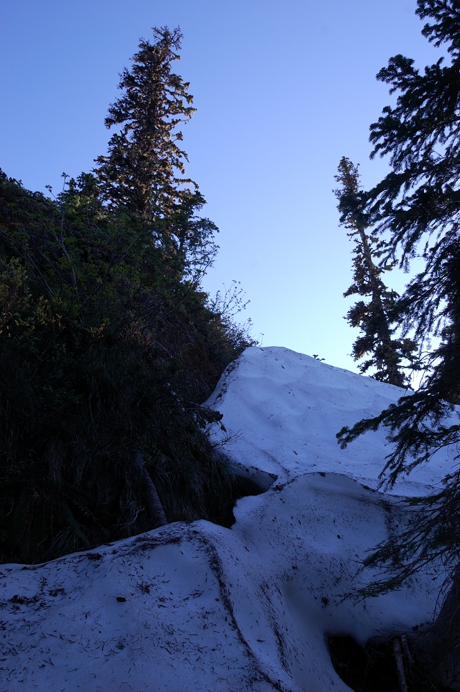 Next I tried to walk around the right side of the rock. We were able to climb this snow drift (10-15 ft high) on east-northeast side all the way to the summit. When this snow drift melts, it's probably a vertical rock there and no easy approach to the sum