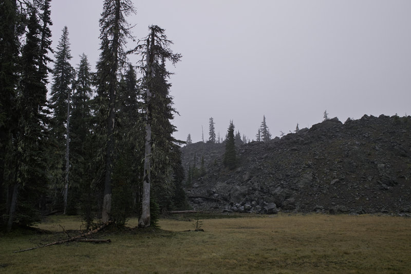 A lava pile next to some fog.