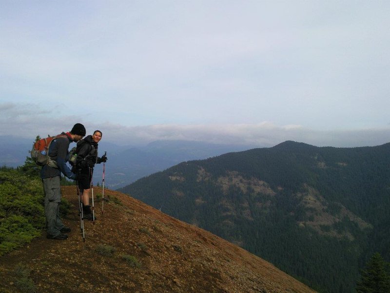 Hunched over from old age and a 30 mile hike or something...