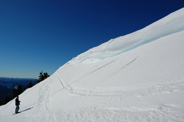 This is visual illusion - the cornice was only about 1.5 feet thick but quite wide so looking from below added to "bulkiness". Still, we were careful near it