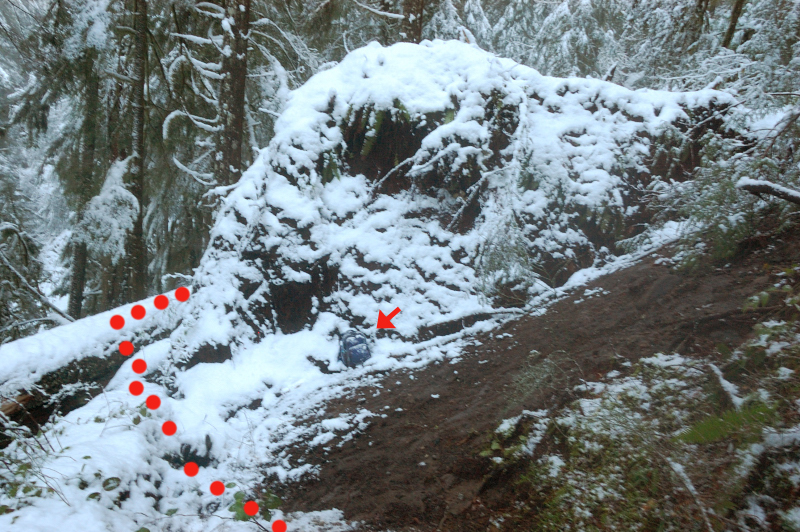 View of the first blowdown from the other side. Note my daypack for scale. Red dots show the easy way around, for the time being