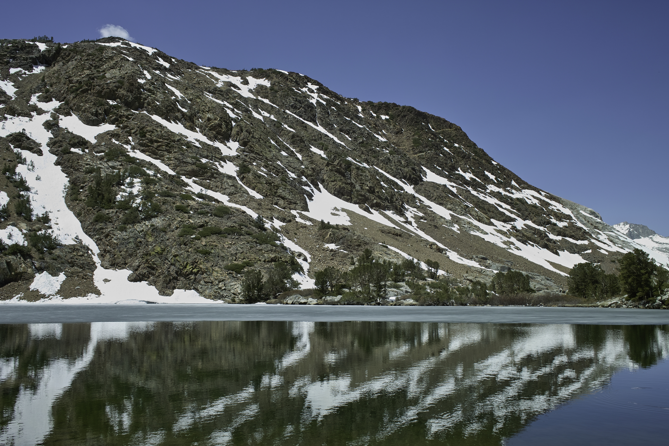 At Middle Chocolate Lake. My guess is they call them the Chocolate Lakes because of the dark brown rock.