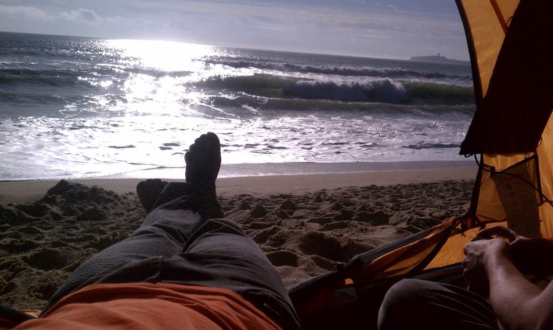 Watching the waves from my tent on the beach.