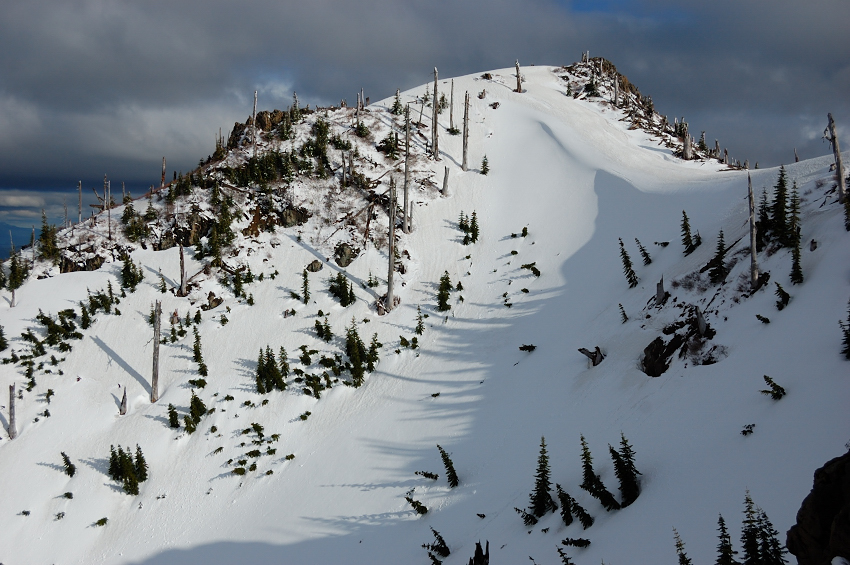 Back side of "Stump Hill", as seen from Arch RIdge. Note a huge snowdrift at the saddle
