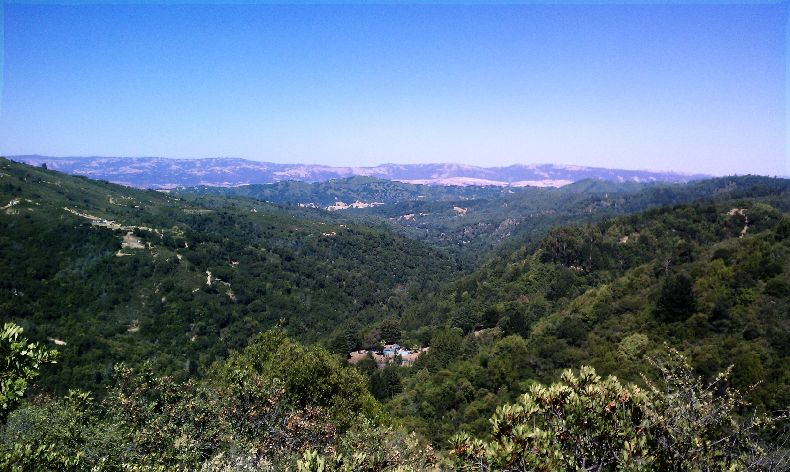 The top of a hill, before going down towards more waterfalls
