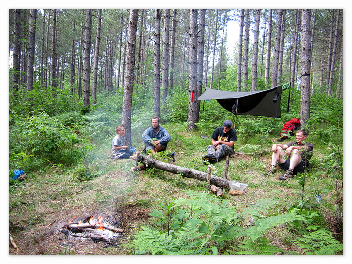 some of the guys sitting around the fire