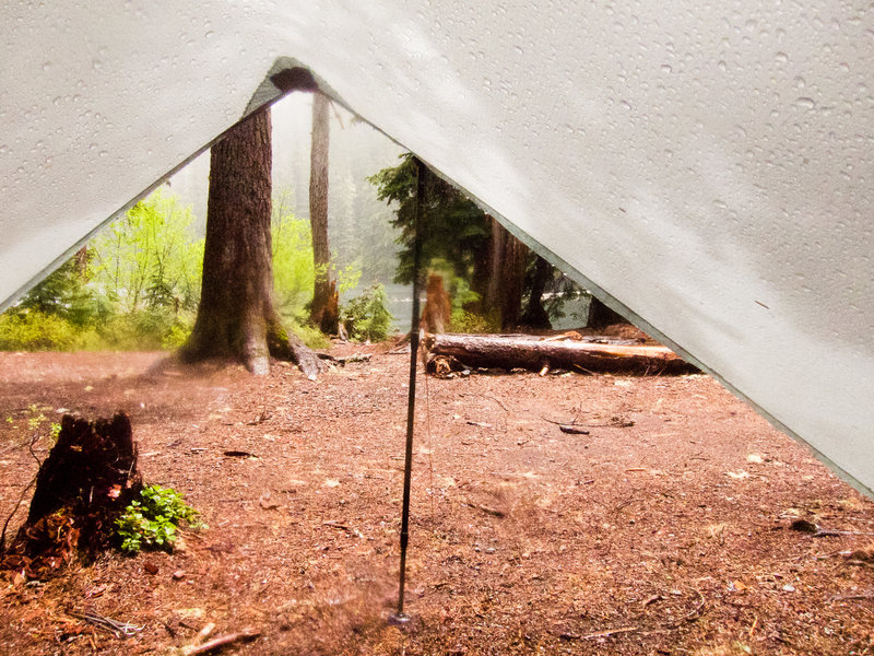 Our view from the tarp at Upper Twin Lake. It's still raining, but look, sun!