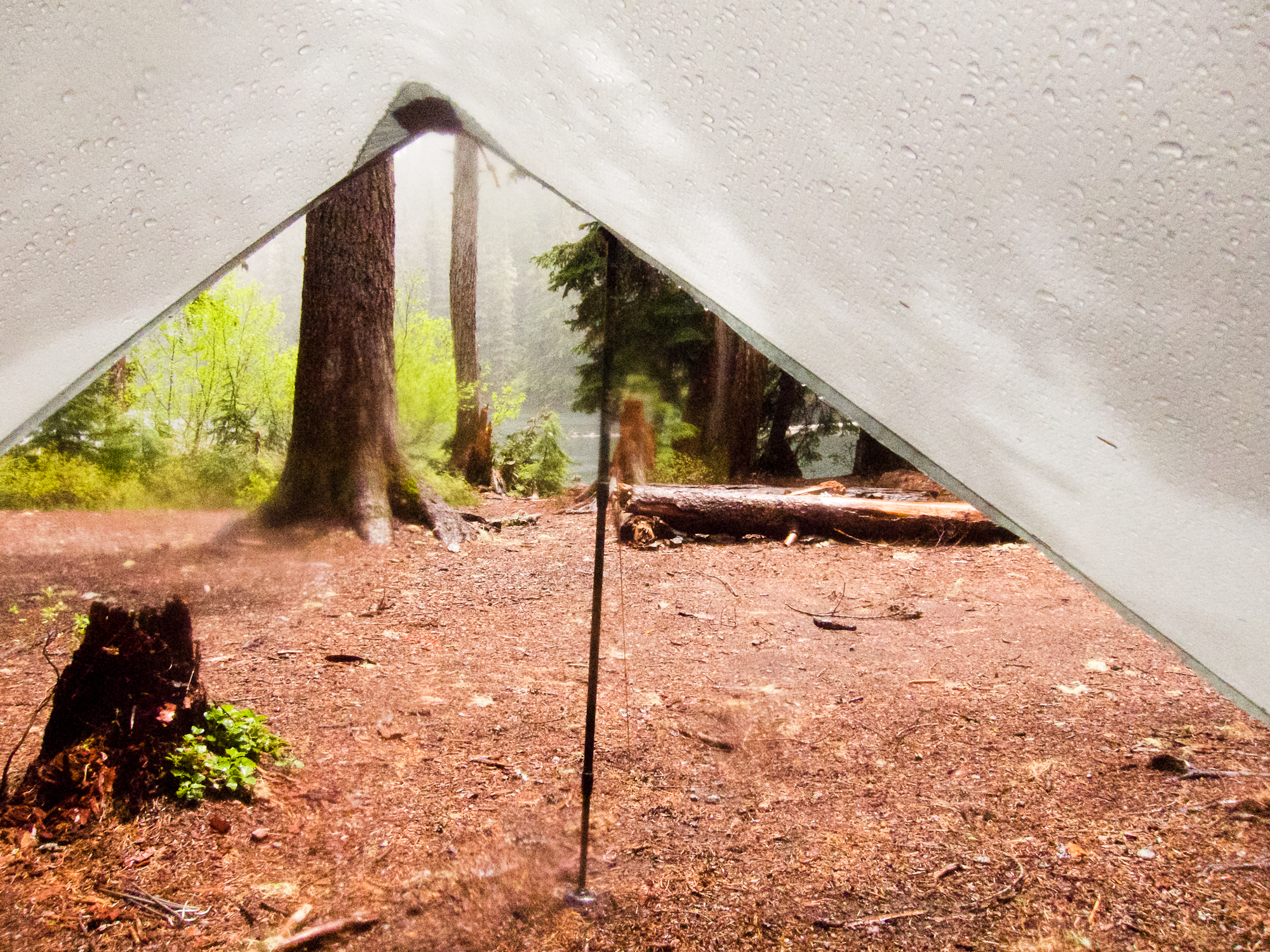 Our view from the tarp at Upper Twin Lake. It's still raining, but look, sun!